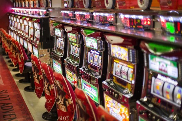 Starburst slot interface on mobile phone showing five reels and payline structure
